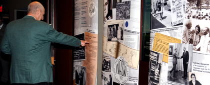 Guest Looking At Historic Photographic Display At 2015 NASW 60th Anniversary Celebration